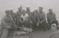 Crew of the PT-230 on the bow of the boat